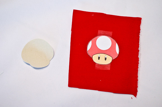 Tape mushroom image to red fabric